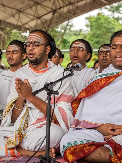 Vedic priests chanting in unison during the Rudra Puja. The synchronized sound of the ancient mantras creates powerful vibrations that resonate throughout the ashram.