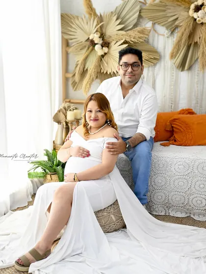 A relaxed family portrait in my cozy boho corner. The natural textures of pampas grass and the peacock chair create a warm and inviting atmosphere for couple and family shots.