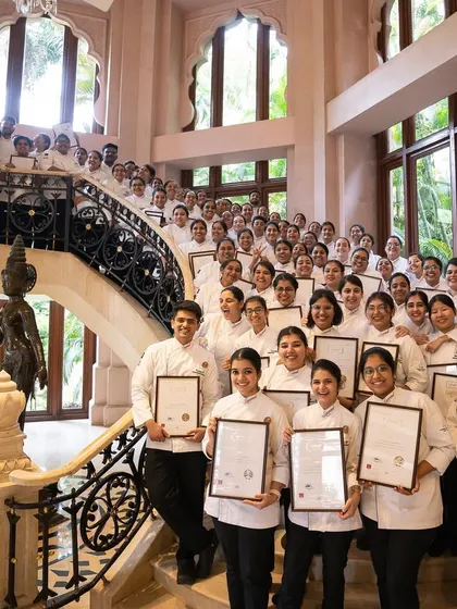 The proud graduates of Diploma Batch 20, standing on the steps of their graduation venue. Each certificate represents months of passion, learning, and perseverance.
