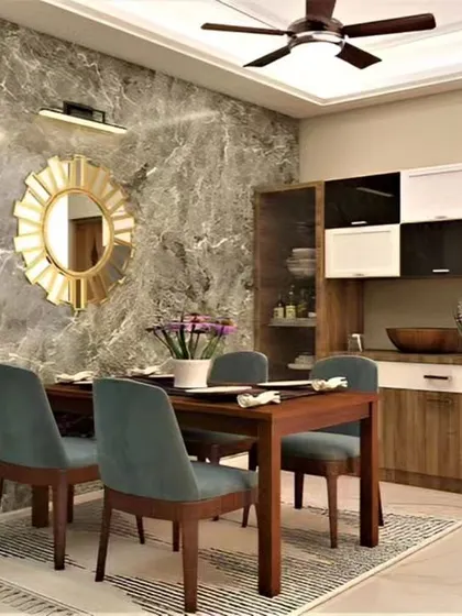 A cozy dining nook with a beautiful marble-finish accent wall. The custom crockery unit provides ample storage while the sunburst mirror adds a touch of glamour.