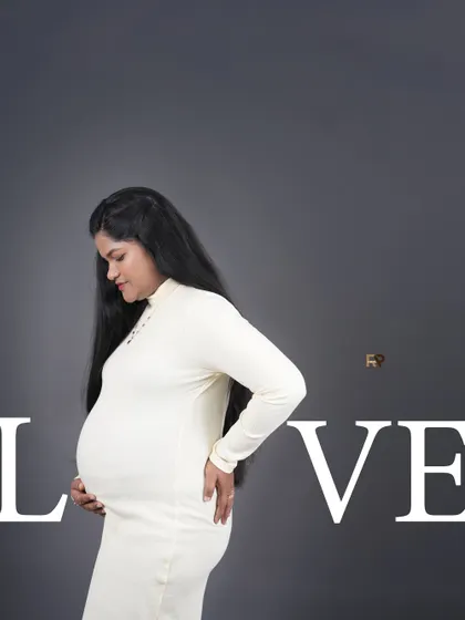 A creative and modern composition. The word "LOVE" is incorporated into the background, adding a graphic design element to this beautiful side-profile portrait.