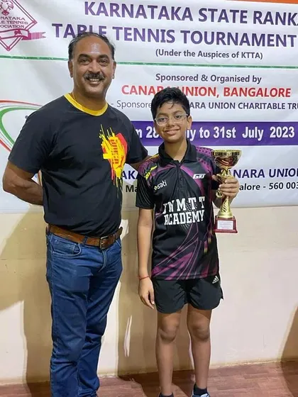 Coach Krunal Telang with Reyansh Jalan, celebrating his gold medal win in the U-13 boys category at the state ranking tournament.