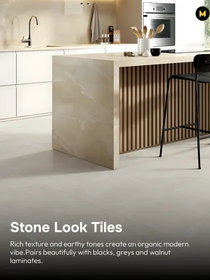 Stone-look tiles with their rich texture and earthy tones create an organic, modern vibe. They pair beautifully with black, grey, and walnut laminates, grounding the space with a natural feel.