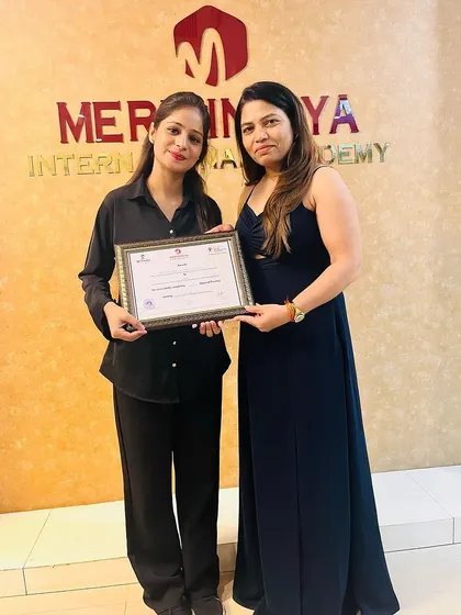 A proud moment for this student, holding her certificate and ready for her professional journey.