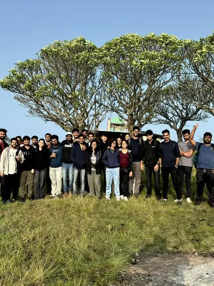 The whole crew under the iconic trees at the top of a hill. Group photos are a must to capture the memories.