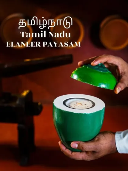 A unique presentation of Elaneer Payasam (tender coconut kheer) served inside a painted coconut shell. This creative shot from a Tamil Nadu menu highlights tradition with a modern, artistic twist.