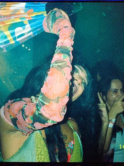 Another candid film photo of me enjoying the party with friends, fan in hand. It’s all about creating a space where I can have as much fun as the guests.