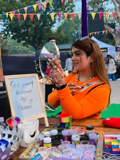 At my glitter makeup station during the Boho Bazaar. It was so much fun helping people get "glittered up" for the event. I love being part of these vibrant, high-energy festivals.