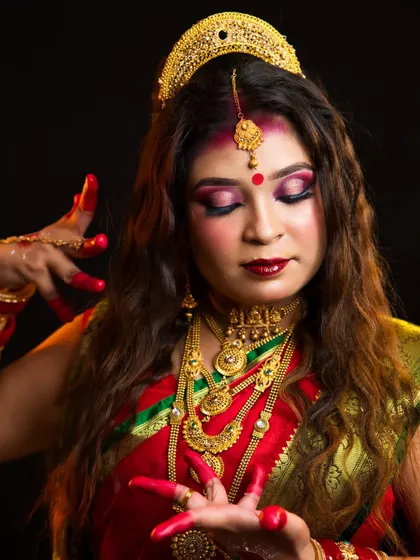 A close-up of the Maa Siddhidatri makeup, focusing on the intricate eye makeup and traditional jewelry.