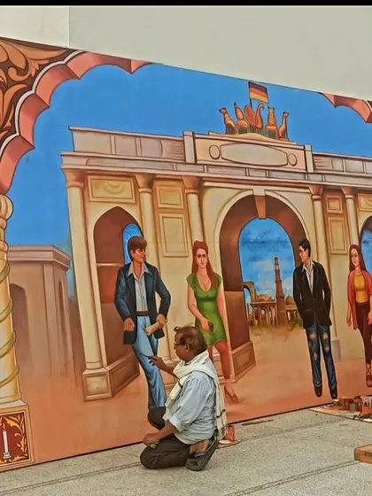 Here I am adding the finishing touches to the large backdrop for the German Embassy. This photo shows the scale of the painting relative to a person.
