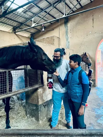 A young rider and his father share a special moment with his new horse, Dreamboy. I believe in involving the entire family in the equestrian journey.