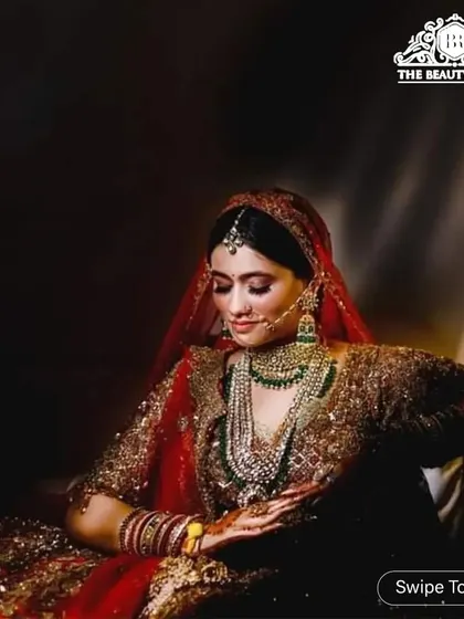 This artistic shot captures the mood of a bride's getting-ready moments. The makeup is rich and dramatic, perfect for a cinematic wedding photo.