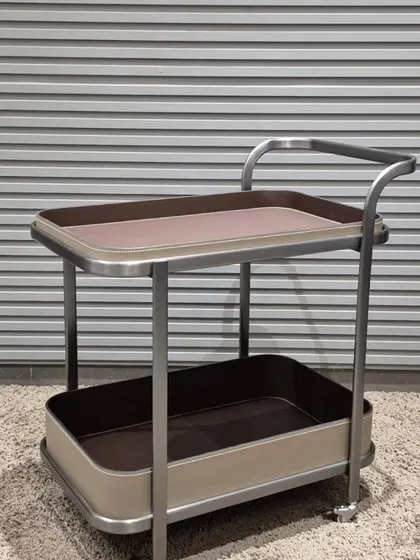 A rectangular bar cart with two spacious trays, perfect for serving drinks or displaying decor.