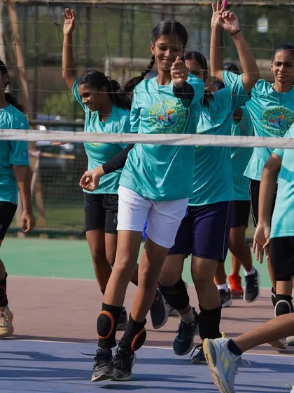 Our girls' team warming up with dynamic exercises. These drills are essential for preparing the body for intense play and preventing injuries.