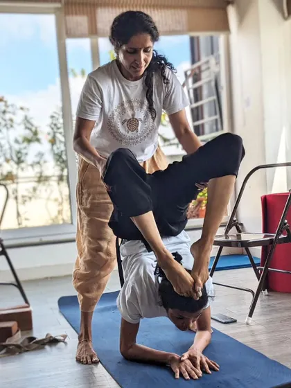 The Guru-Shishya (teacher-student) relationship is sacred. Here, we provide hands-on guidance to help a student safely explore Vrischikasana (Scorpion Pose). Our small class sizes ensure you receive the personal attention needed to grow in your practice with confidence and correct alignment.