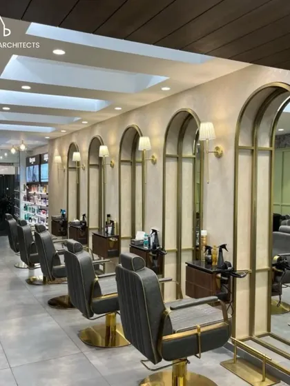 The main styling floor at Bella Madonna, where we used a series of arched mirrors and wall sconces to create a classic and elegant atmosphere. The layout is designed for efficient workflow while ensuring each client has a personal and comfortable space.