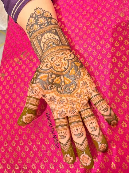 A unique design with a reverse-fill technique, where the background is darkened to make the floral and paisley motifs shine.
