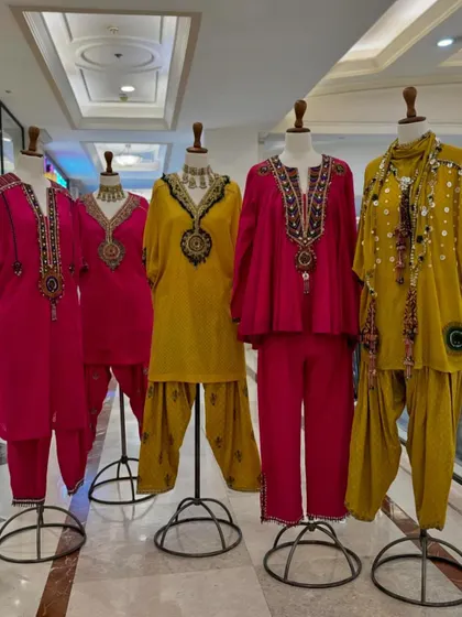 A full display of these vibrant and festive kurta sets. The dhoti-style pants add a modern, edgy twist to the traditional kurta.