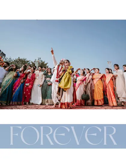 A wide shot of the wedding party celebrating together, a beautiful moment of unity and happiness.