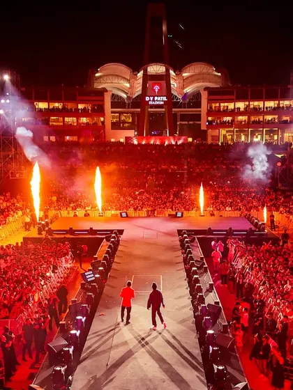 A hero's entrance. We craft dramatic moments like this, using pyrotechnics and a custom-built stage ramp to create an unforgettable entry for the artists, setting the tone for an epic performance.