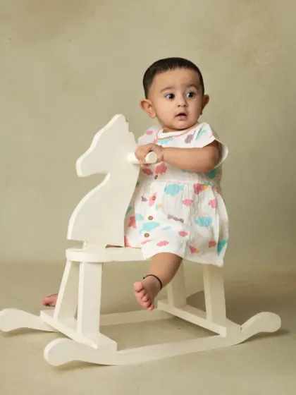 A collection of simple, classic portraits of twin babies. Without props or themes, their individual expressions and connection are beautifully highlighted.
