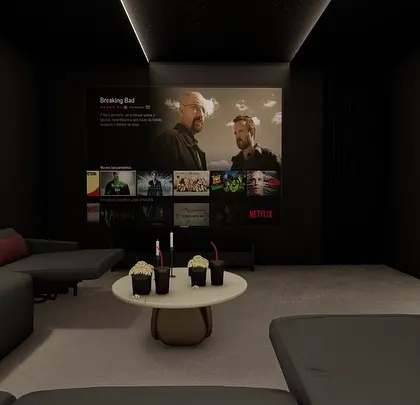 This angle shows how a large art piece on the wall can balance the visual weight of the big screen, integrating the theater into the room's overall decor.