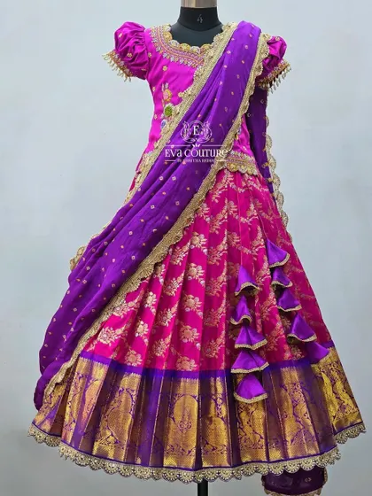 The same pink and purple lehenga shown with a matching dupatta. This transforms it into a beautiful half-saree style outfit for older girls.