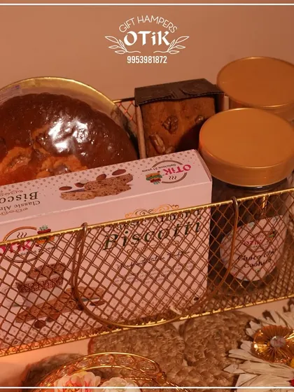 Another angle of the golden wire basket hamper, showing the variety of items included, perfect for sharing with family and friends during the festival.