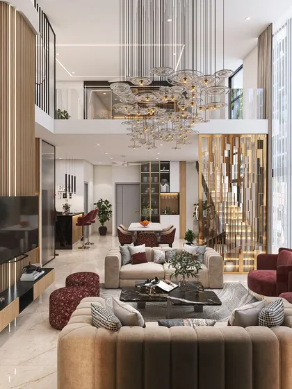 Another view of the spectacular double-height living room, showing the open-plan layout that connects to the dining area and the upper floor. The floor-to-ceiling windows flood the space with light.