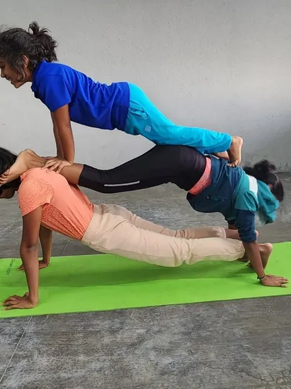 This three-person plank stack is a great example of teamwork and progressive strength building.