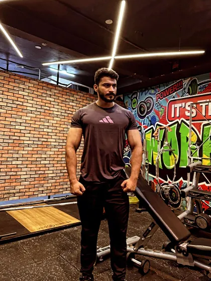 A devotee of Mahakal. A relaxed but strong stance in the gym.