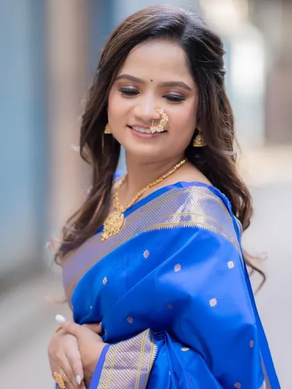A close-up of the bride's soft and subtle engagement makeup. The focus is on flawless skin and enhancing her natural features.