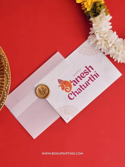 We also offer custom wish cards for Ganesh Chaturthi. This card features a modern Ganesha graphic and is paired with a wax-sealed envelope for an elegant touch.