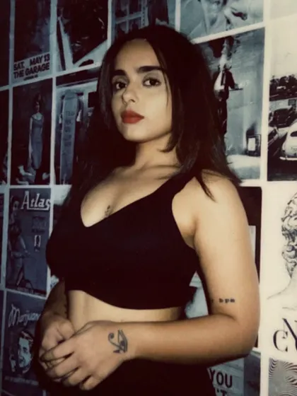 A polaroid-style shot against a wall of posters. This image has a vintage, raw feel that reflects my love for old-skool sounds and authentic vibes.