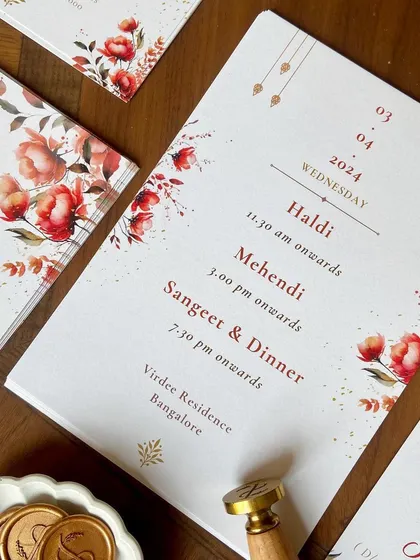 A closer look at the details from this beautiful wedding suite. The design included multiple inserts with event details, custom floral envelope liners, and a personalized wax seal with the couple's initials.