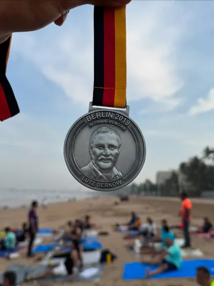 The Berlin Marathon medal from 2019. Running this fast, flat course is a dream for many marathoners, and we provide the training to help you get there.