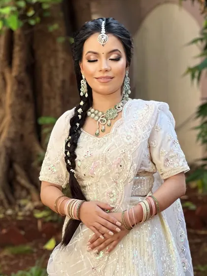 A beautiful portrait from our airbrush makeup seminar. This white bridal look features flawless skin, soft eye makeup, and a traditional braided hairstyle, all coming together for an ethereal effect.