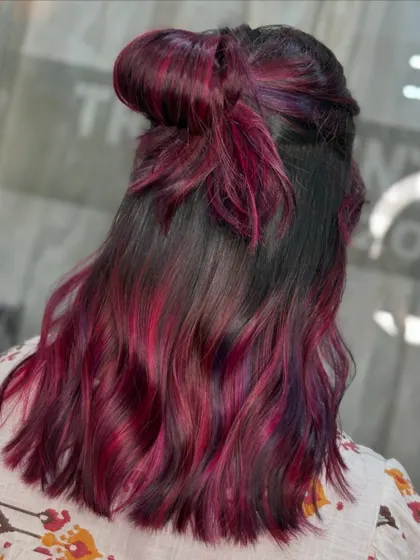 A cute half-up bow style showcasing the vibrant pink and violet hues. This demonstrates how fun and versatile bold colors can be.