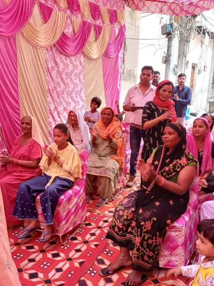 The audience at our community event, fully engaged and participating in the celebration. I make it a point to create an inclusive atmosphere where women, children, and youth all feel like a part of the occasion.