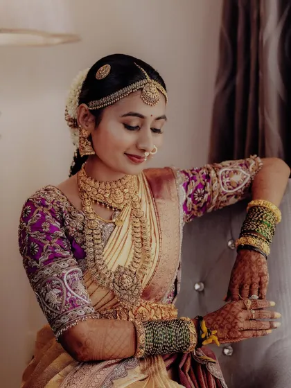 It was a joy to bring Jahnvi's dream engagement attire to life. I paired her beautiful Kanchipuram saree with a custom blouse featuring intricate handwork on the sleeves and added a flowing veil for a princess-like charm.