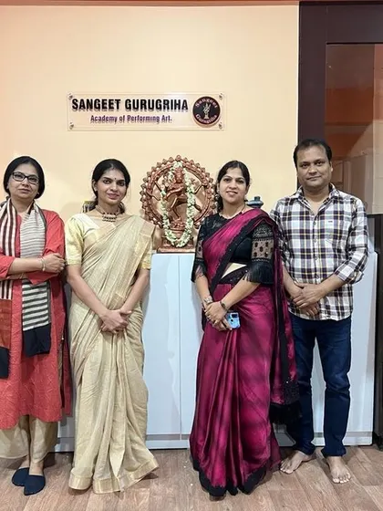 The core team of Sangeet Gurugriha with an examiner, celebrating another successful session.