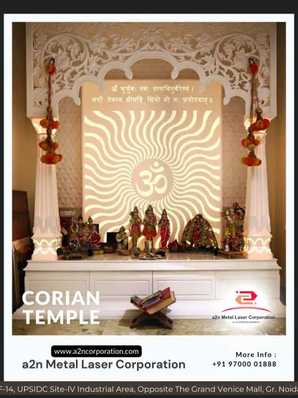A grand Corian temple with an ornate arch and pillars, featuring a backlit "Om" symbol with a wave pattern. This piece exemplifies our expertise in creating elaborate, custom-designed mandirs that become the spiritual heart of a home.