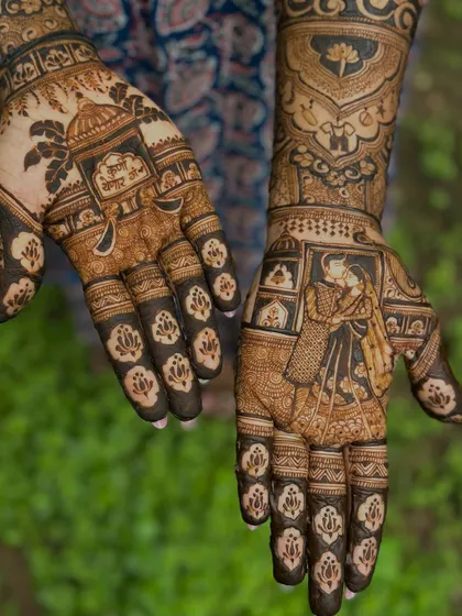 The complete design, with a couple portrait on one hand and a traditional temple motif on the other, symbolizing blessings for their growing family.
