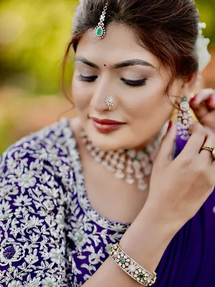 A beautiful and elegant reception look. The makeup is soft and romantic, with a focus on glowing skin and defined eyes.