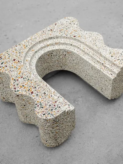 Another perspective of the terrazzo art piece, showing how the arches and curves create a dynamic interplay of light and shadow.