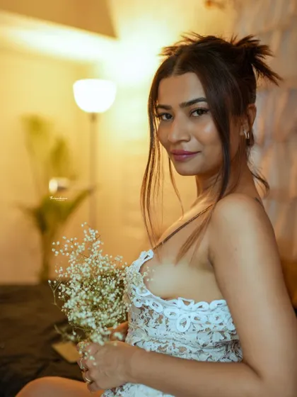 A candid, happy moment from the same indoor session. I always look for these genuine expressions to complement the more posed shots.