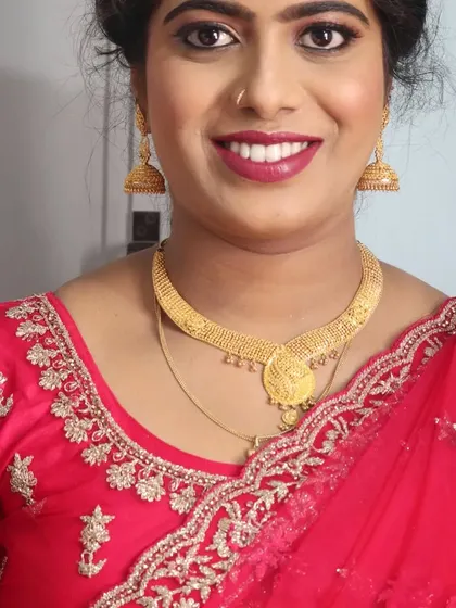 A happy smile from Ayesha, looking confident and beautiful for her brother's wedding celebration.