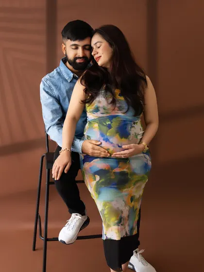 An intimate and modern couple's portrait, capturing a quiet moment of connection in a contemporary style.
