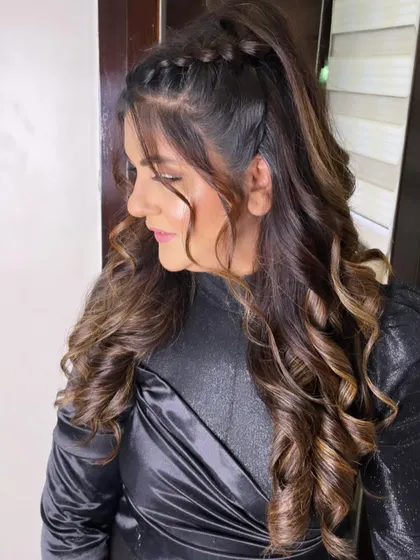 Another look at this braided half-ponytail. The combination of the braid and soft curls creates a beautiful, romantic, and trendy style.