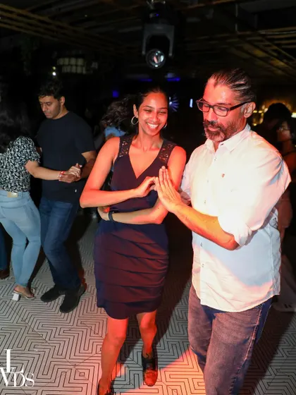 A couple dancing Jive at our studio social. The energy is high and the smiles are genuine.